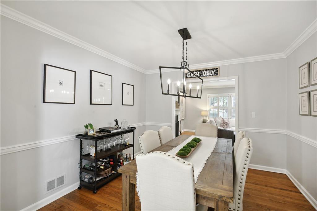 1403 Moores Mill Road Northwest Atlanta, GA 30327 - Photo 8 of 30 a view of a dining room with furniture