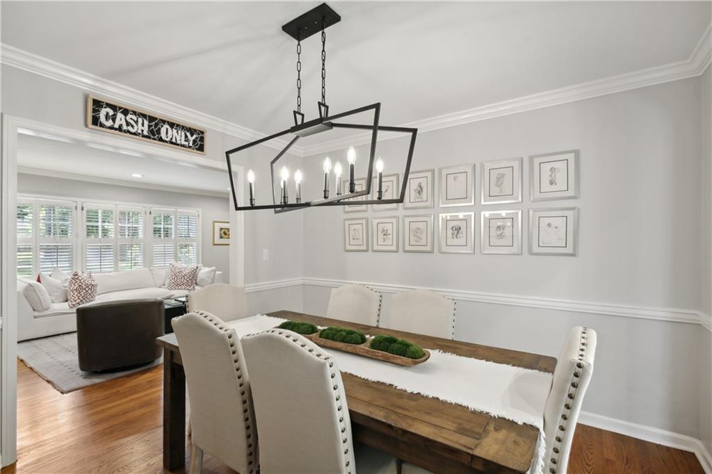1403 Moores Mill Road Northwest Atlanta, GA 30327 - Photo 9 of 30 a kitchen that has a stove and a table in it