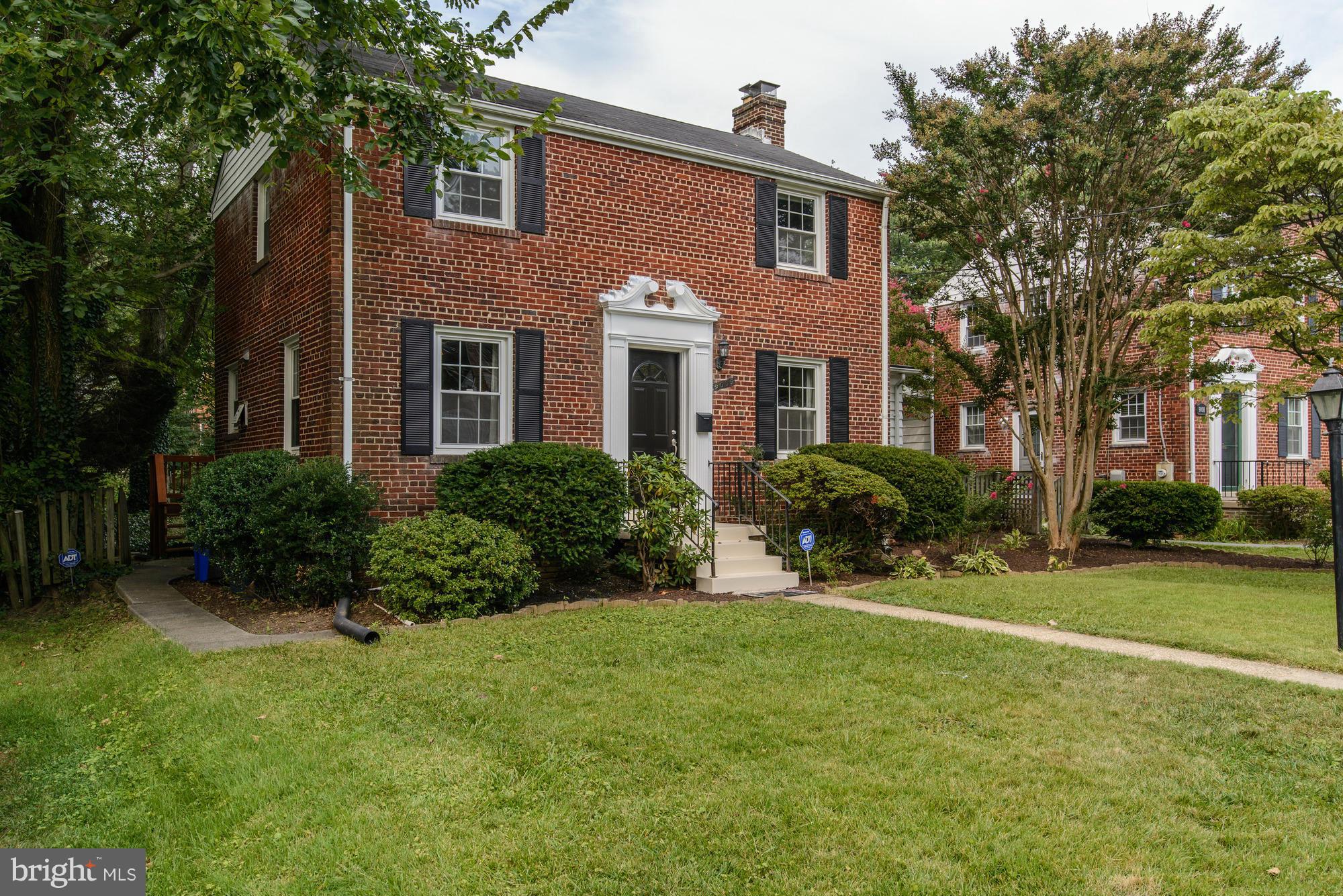 9006 Walden Road Silver Spring, MD 20901 - Photo 2 of 30 a front view of a house with garden and porch