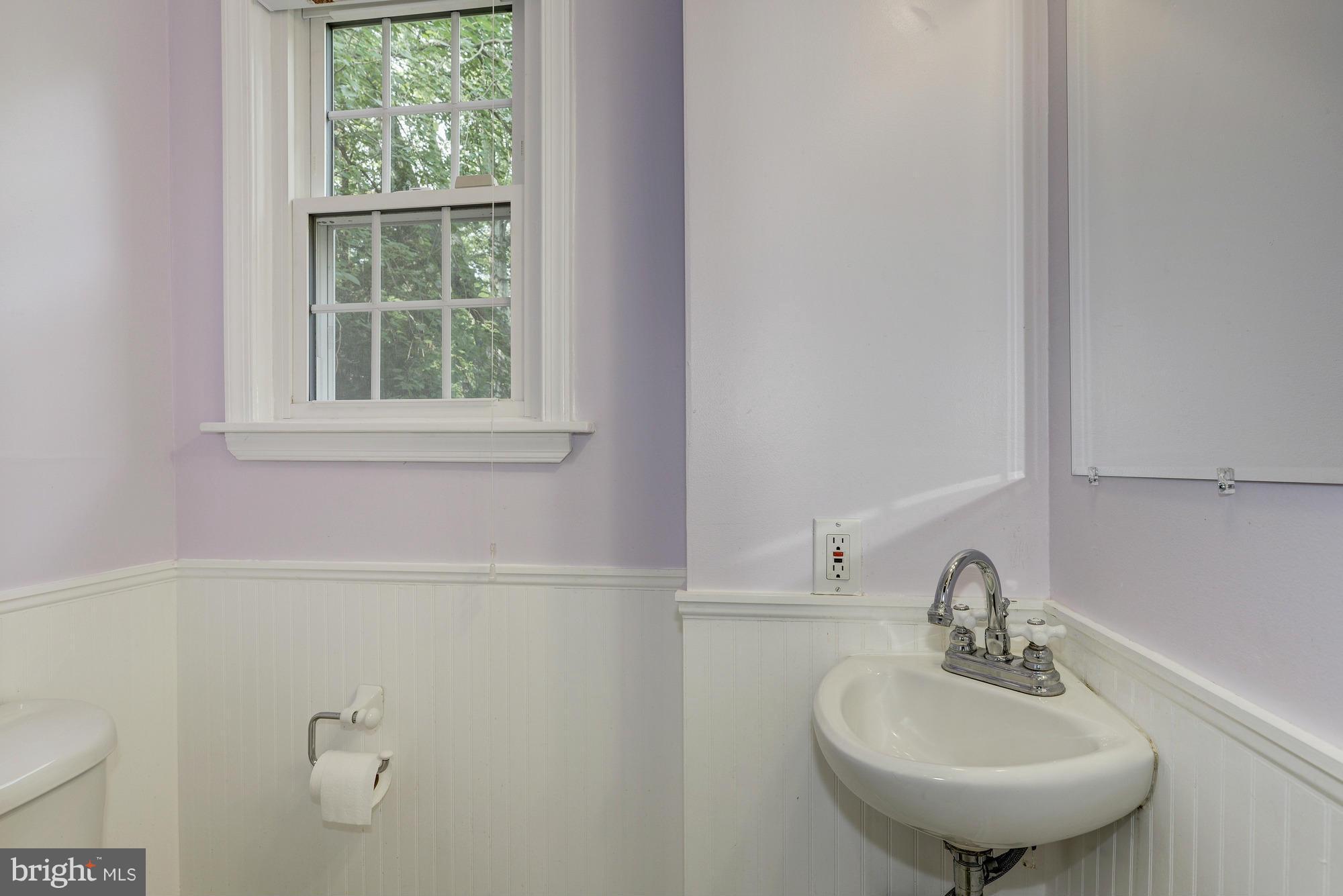 9006 Walden Road Silver Spring, MD 20901 - Photo 15 of 30 a bathroom with a sink and a mirror
