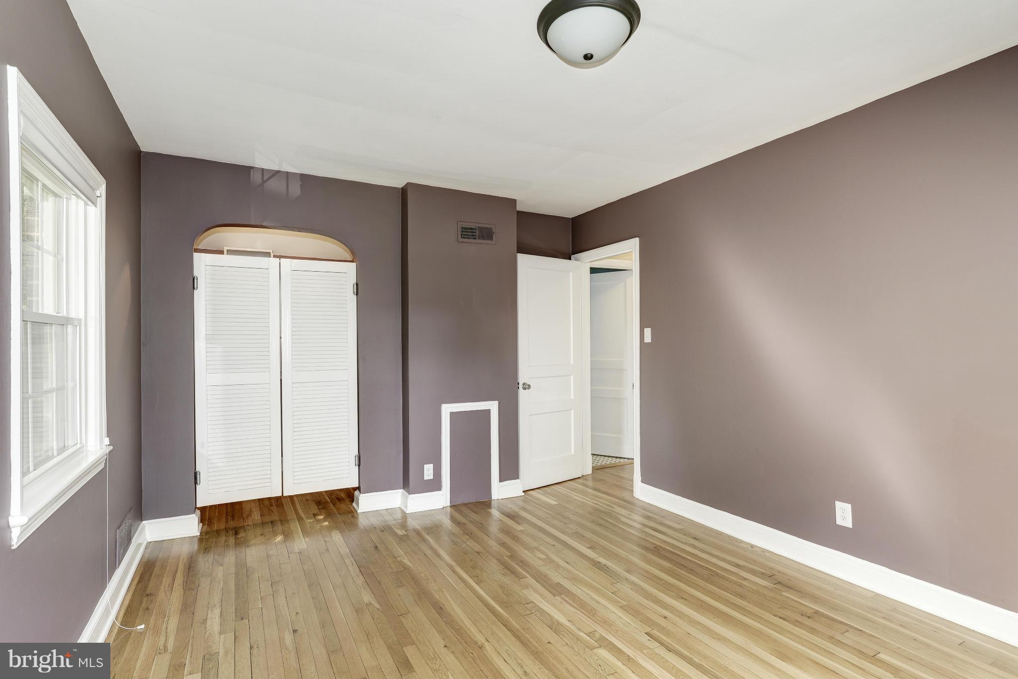 9006 Walden Road Silver Spring, MD 20901 - Photo 18 of 30 a view of empty room with wooden floor and fan