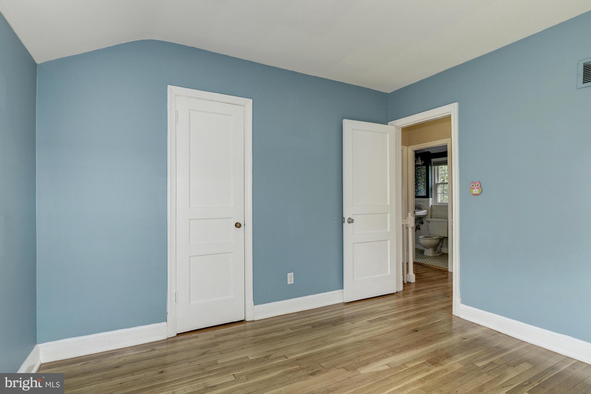 9006 Walden Road Silver Spring, MD 20901 - Photo 21 of 30 a view of an empty room with wooden floor and closet