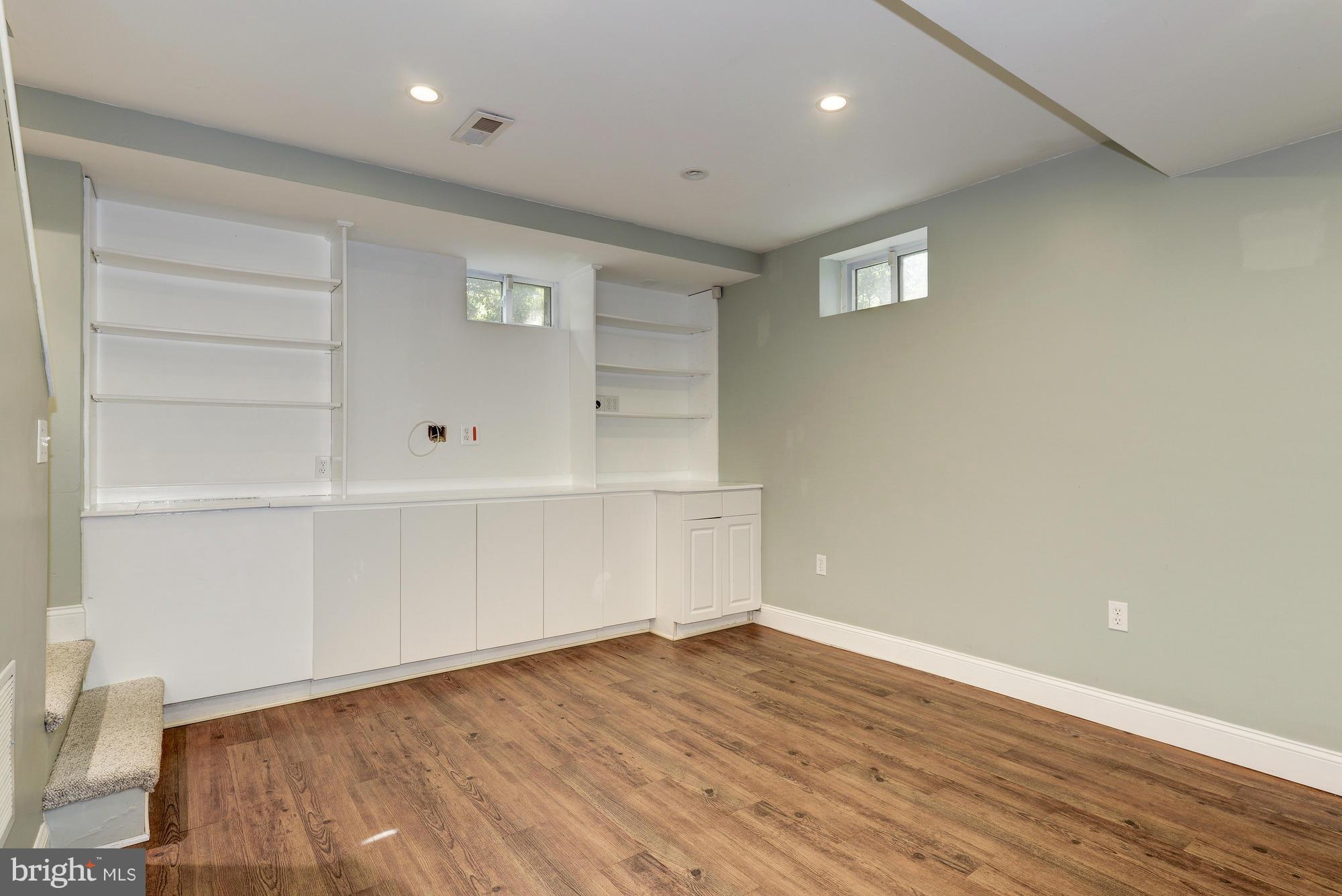 9006 Walden Road Silver Spring, MD 20901 - Photo 24 of 30 a view of an empty room with wooden floor and closet