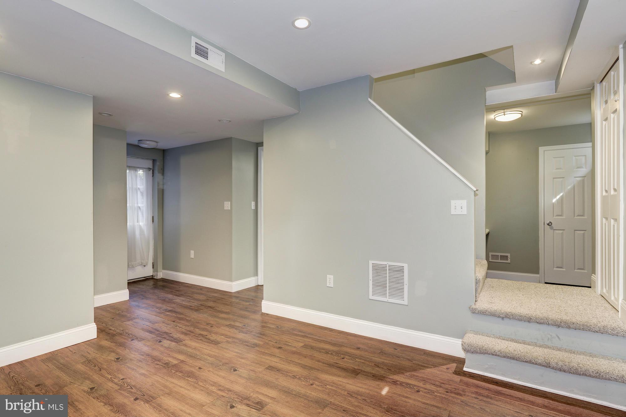 9006 Walden Road Silver Spring, MD 20901 - Photo 25 of 30 a view of livingroom with hardwood floor and bathroom