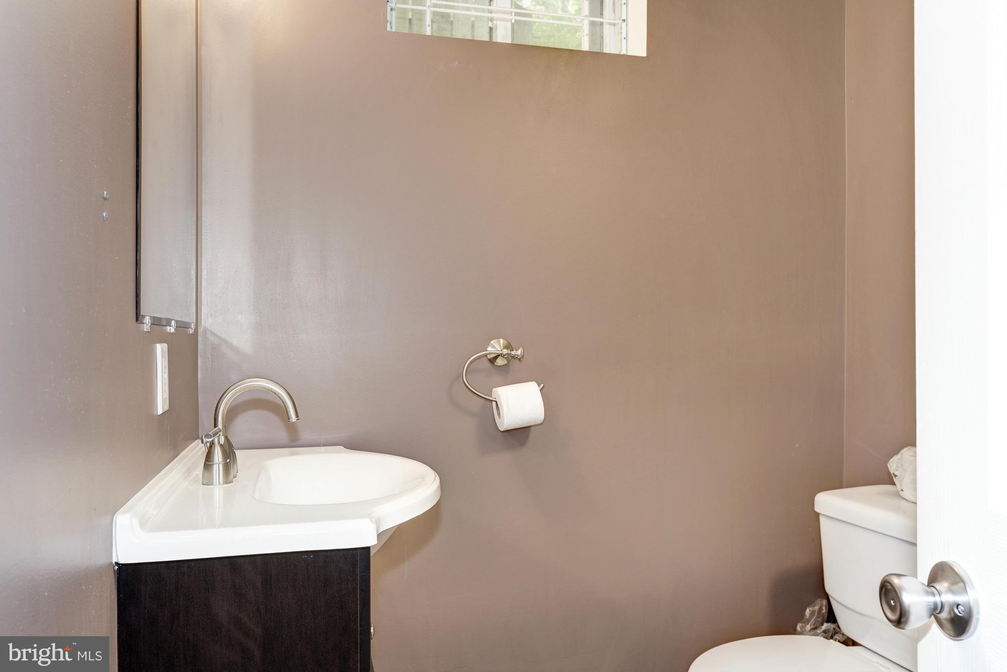 9006 Walden Road Silver Spring, MD 20901 - Photo 26 of 30 a bathroom with a sink and a toilet