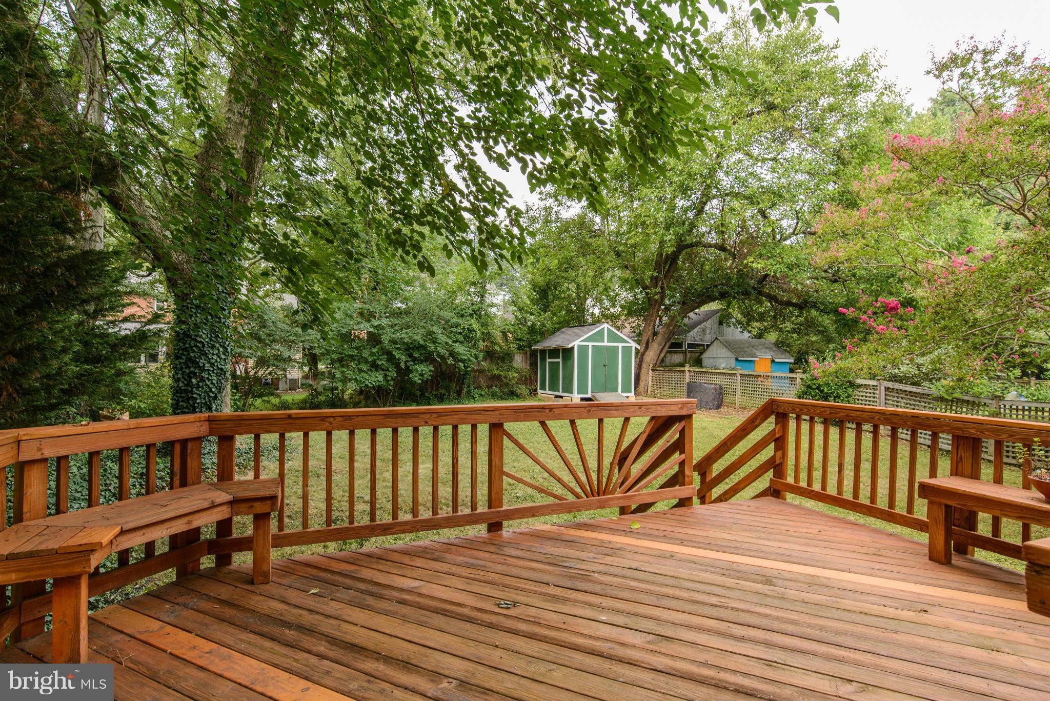 9006 Walden Road Silver Spring, MD 20901 - Photo 27 of 30 a view of a roof deck with wooden floor and outdoor seating