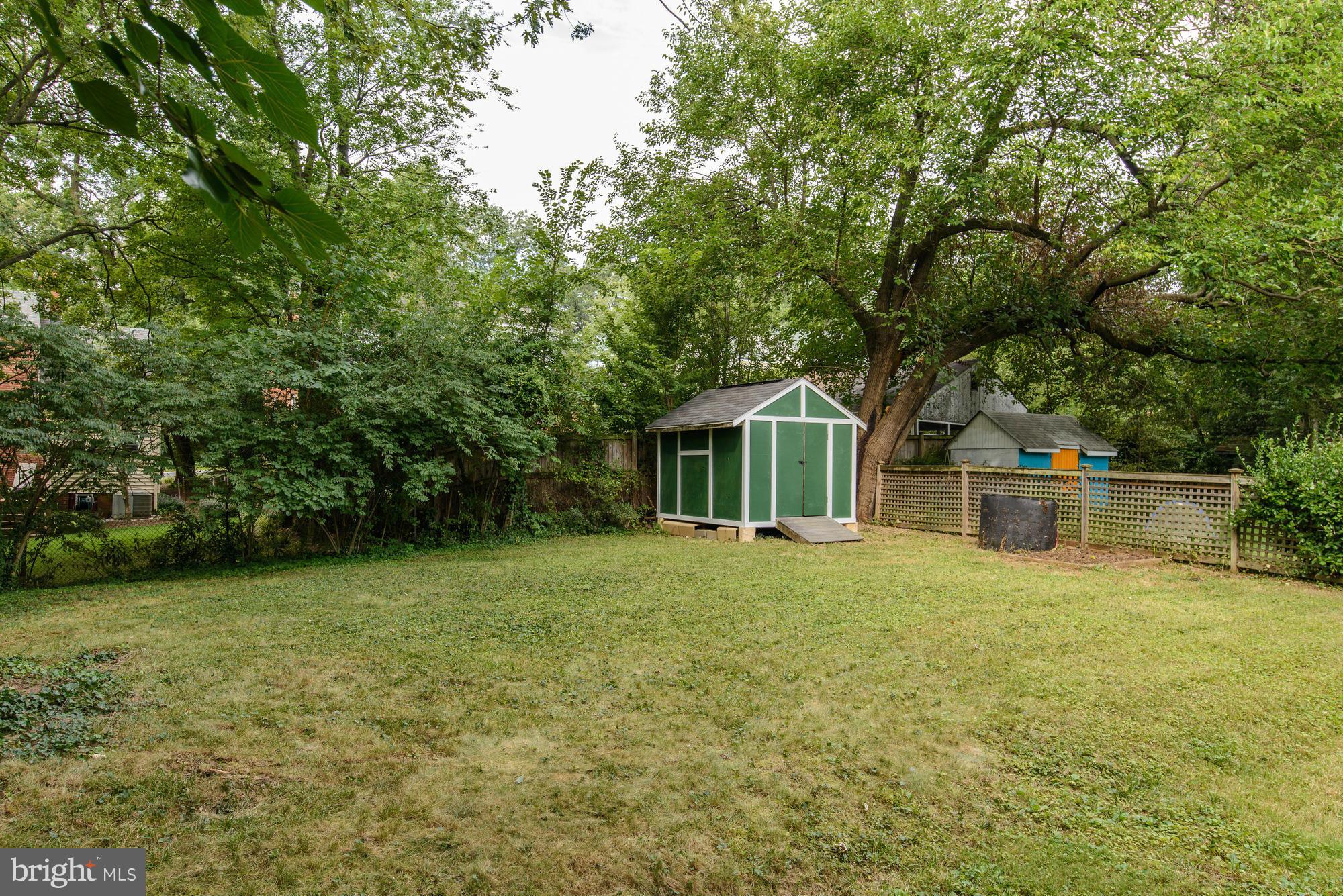 9006 Walden Road Silver Spring, MD 20901 - Photo 29 of 30 a front view of a house with a yard and trees