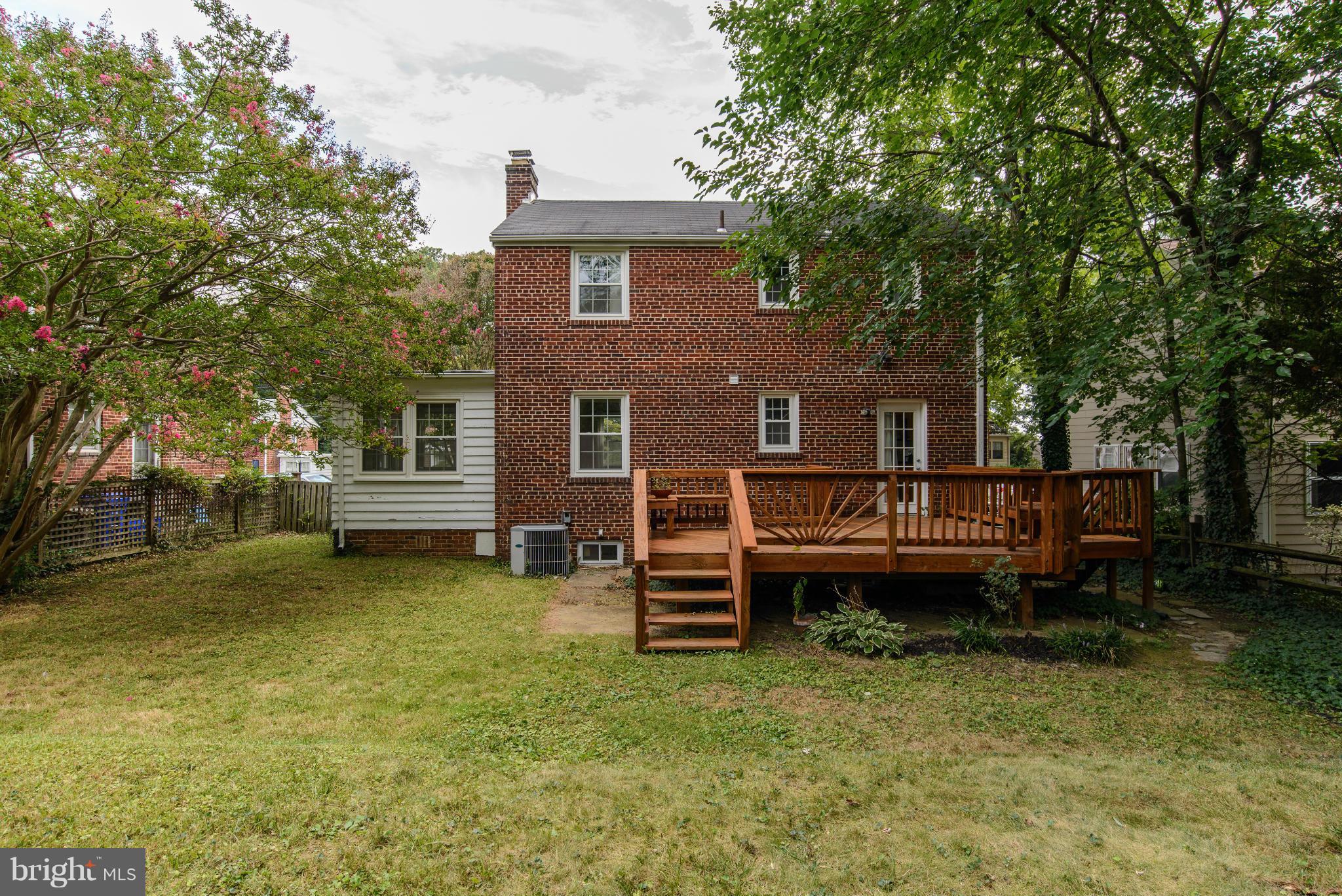 9006 Walden Road Silver Spring, MD 20901 - Photo 30 of 30 a view of a house with a wooden deck and a large tree