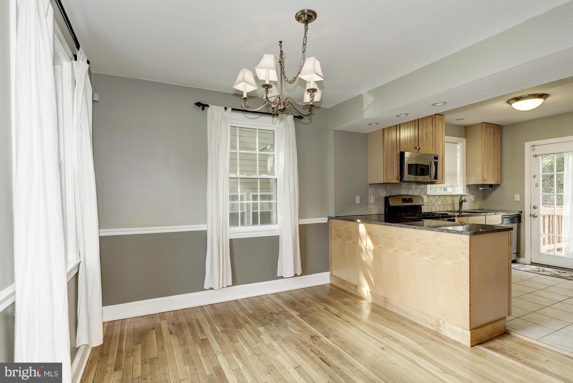 9006 Walden Road Silver Spring, MD 20901 - Photo 10 of 30 a view of a kitchen with granite countertop a stove top oven