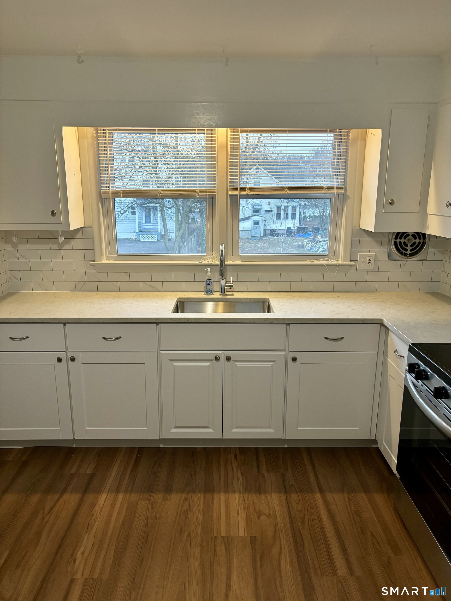 a kitchen with sink cabinets and window