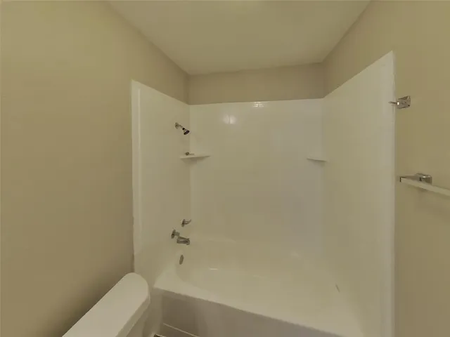 a kitchen with stainless steel appliances granite countertop a refrigerator a stove and a window