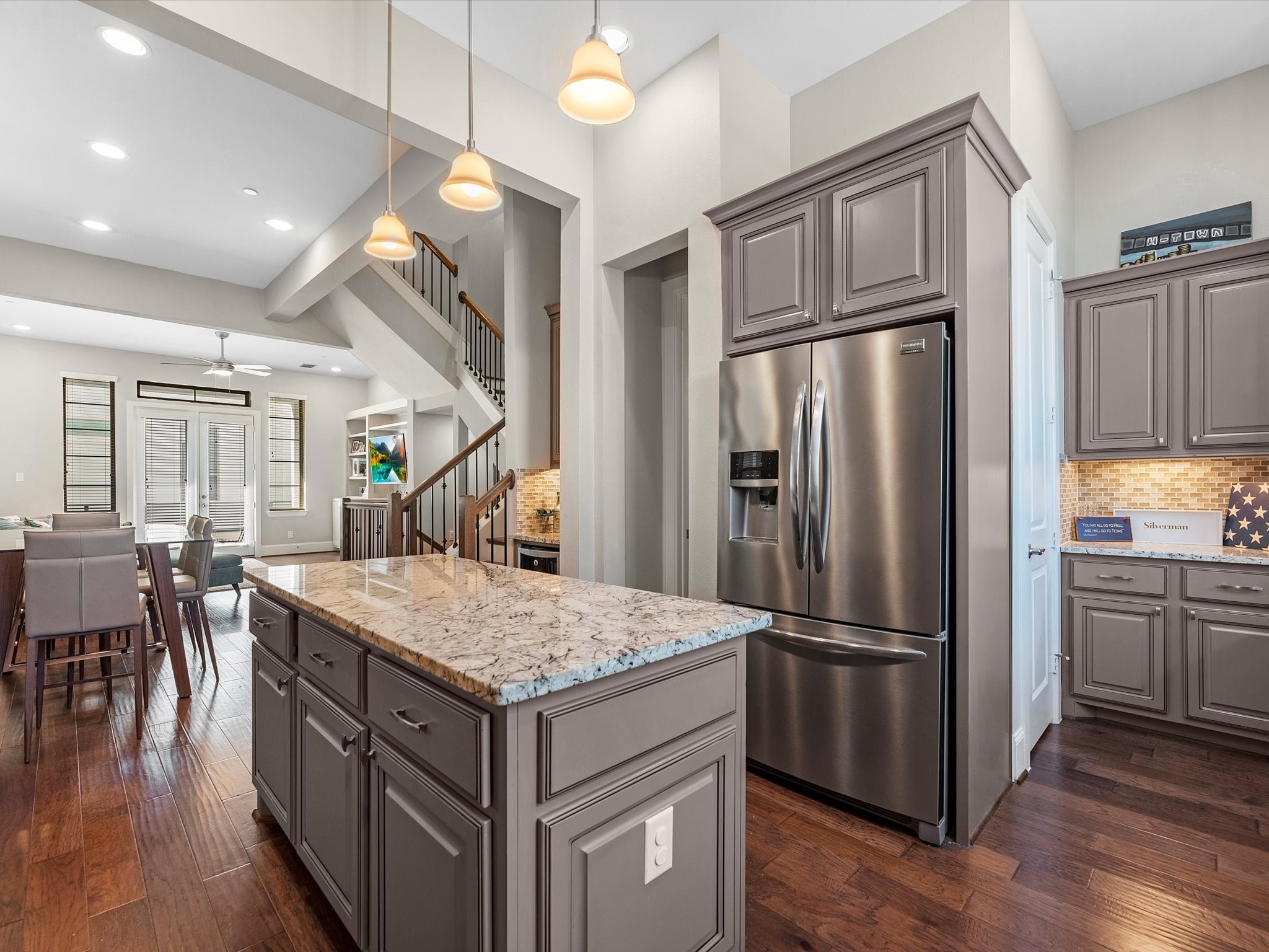 5467 Larkin Street Houston, TX 77007 - Photo 11 of 33 a kitchen with stainless steel appliances granite countertop a refrigerator and a stove top oven