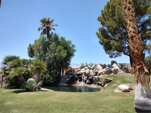 a view of a backyard of the house