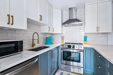 a kitchen with a sink and cabinets