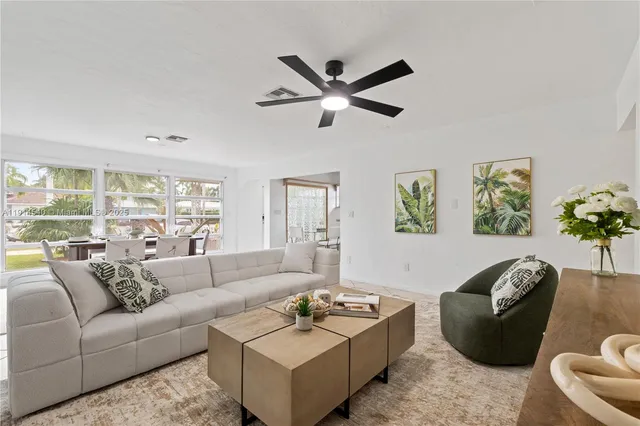 a kitchen with a stove a sink and a microwave