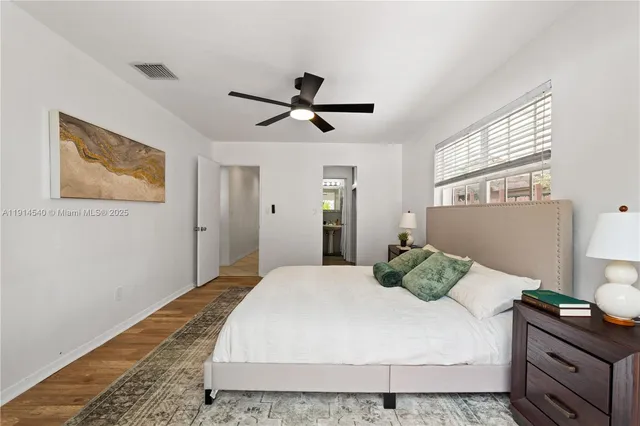 a view of a hallway with a white door and a white door