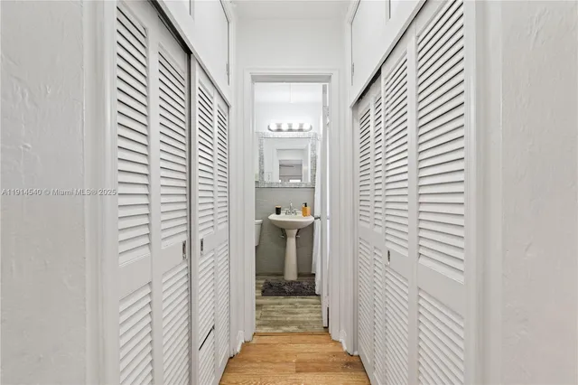 a white toilet sitting next to a bathroom sink