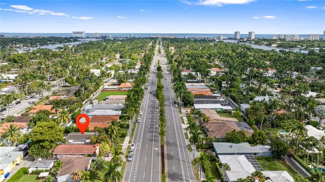 an aerial view of residential houses with outdoor space and street view