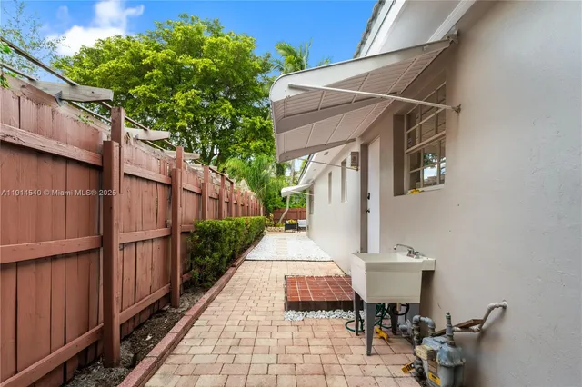 a view of a door and chair in the patio
