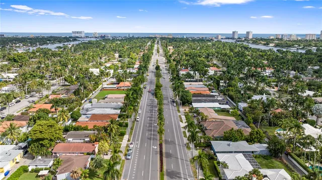 an aerial view of a house with garden space and swimming pool