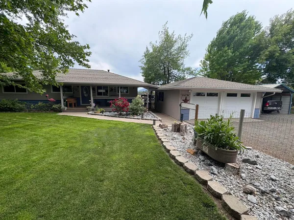 a front view of a house with garden