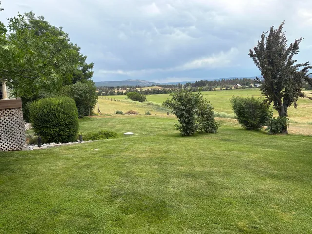 a view of a lake with a big yard