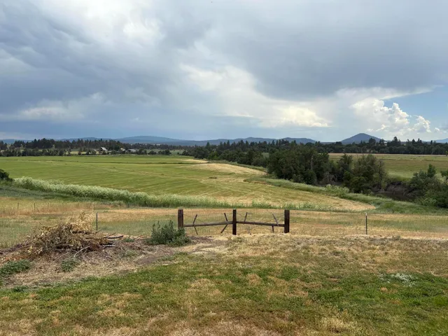 a view of a lake with a yard