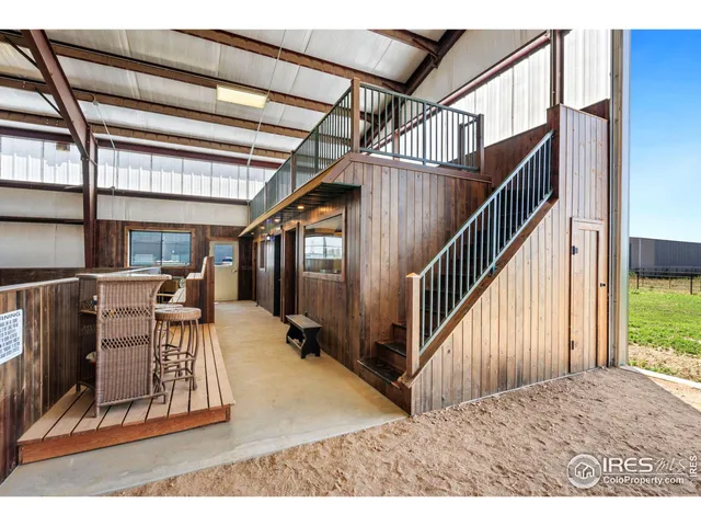 a very nice looking bedroom with a large window