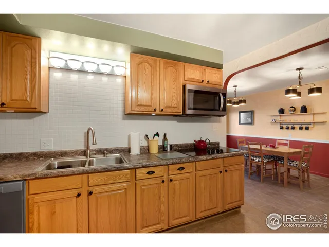a bedroom with a bed window and couch