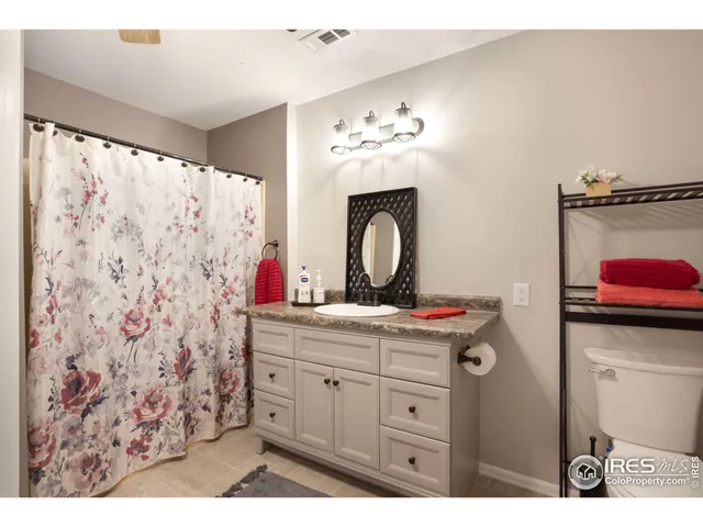 a open kitchen with cabinets and wooden floor