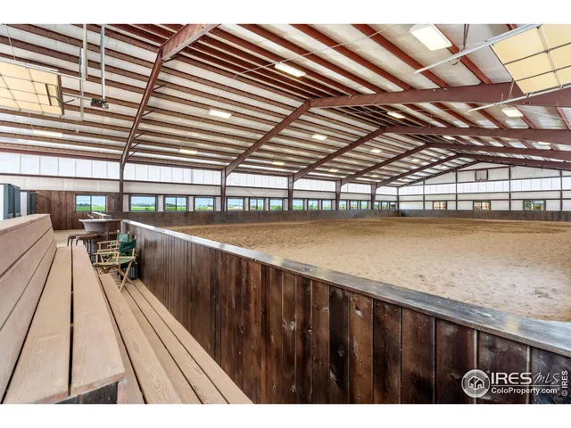 a kitchen with stainless steel appliances wooden cabinets and table chairs