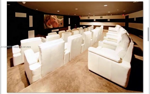 a living room with furniture a table and chairs