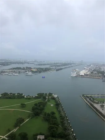 a view of a lake with houses in the back