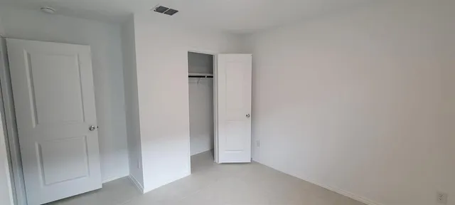 a view of an empty walk in closet