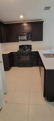 a kitchen with a sink and a stove