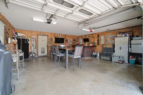 a view of a big room with air conditioner duct and materials on floor