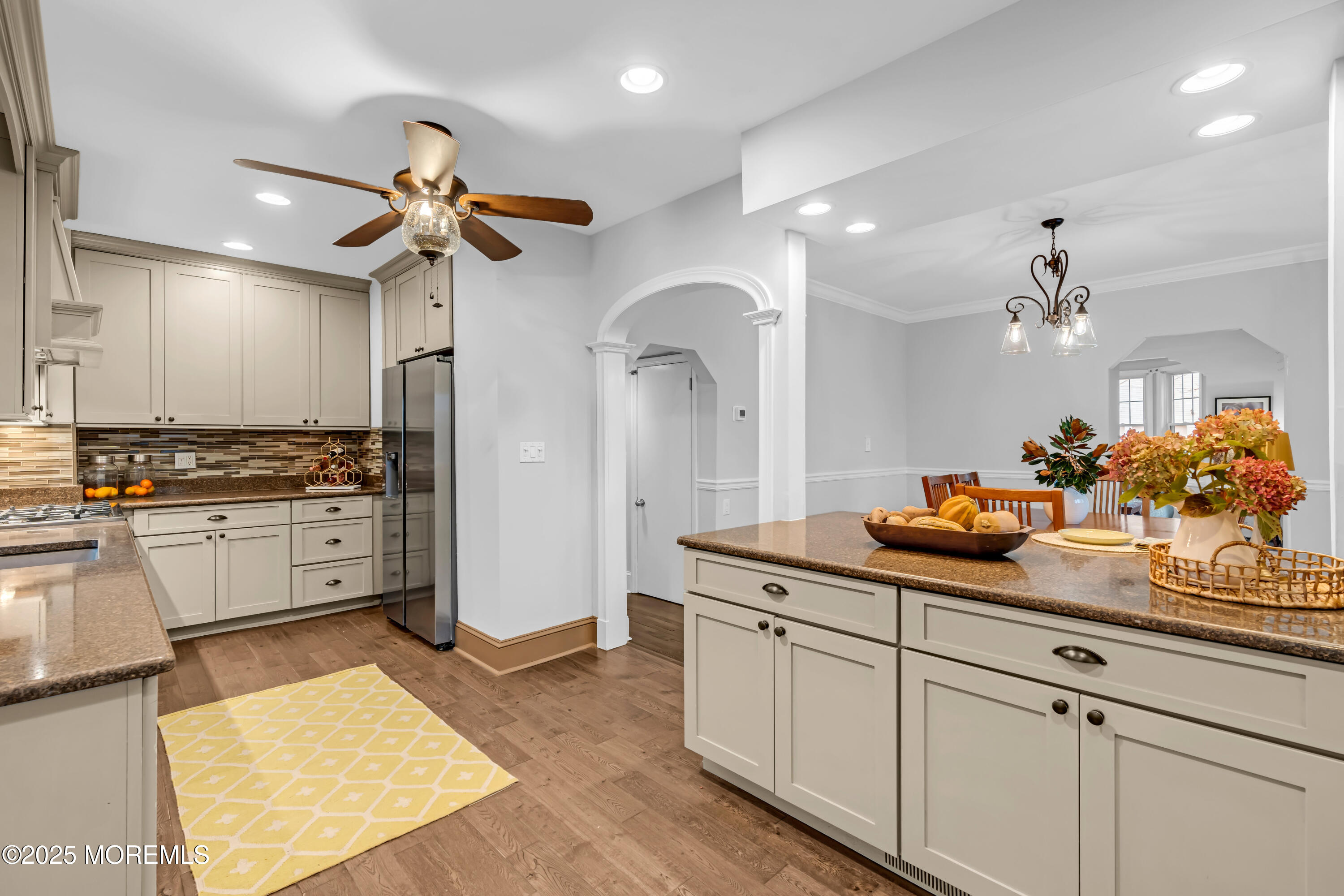 18 Middletown Avenue Atlantic Highlands, NJ 07716 - Photo 18 of 35 a kitchen with white cabinets and chandelier