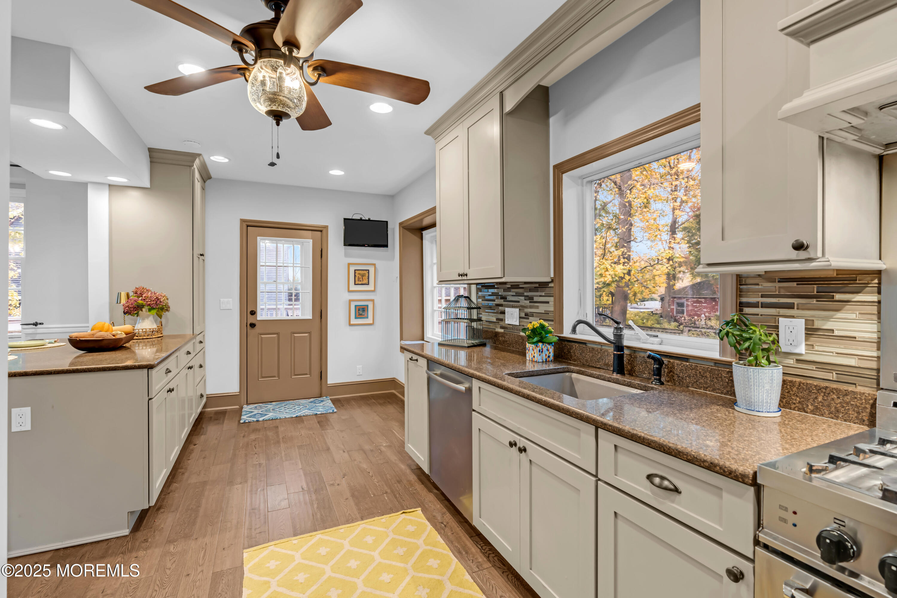 18 Middletown Avenue Atlantic Highlands, NJ 07716 - Photo 20 of 35 a kitchen with stainless steel appliances granite countertop a sink stove and refrigerator
