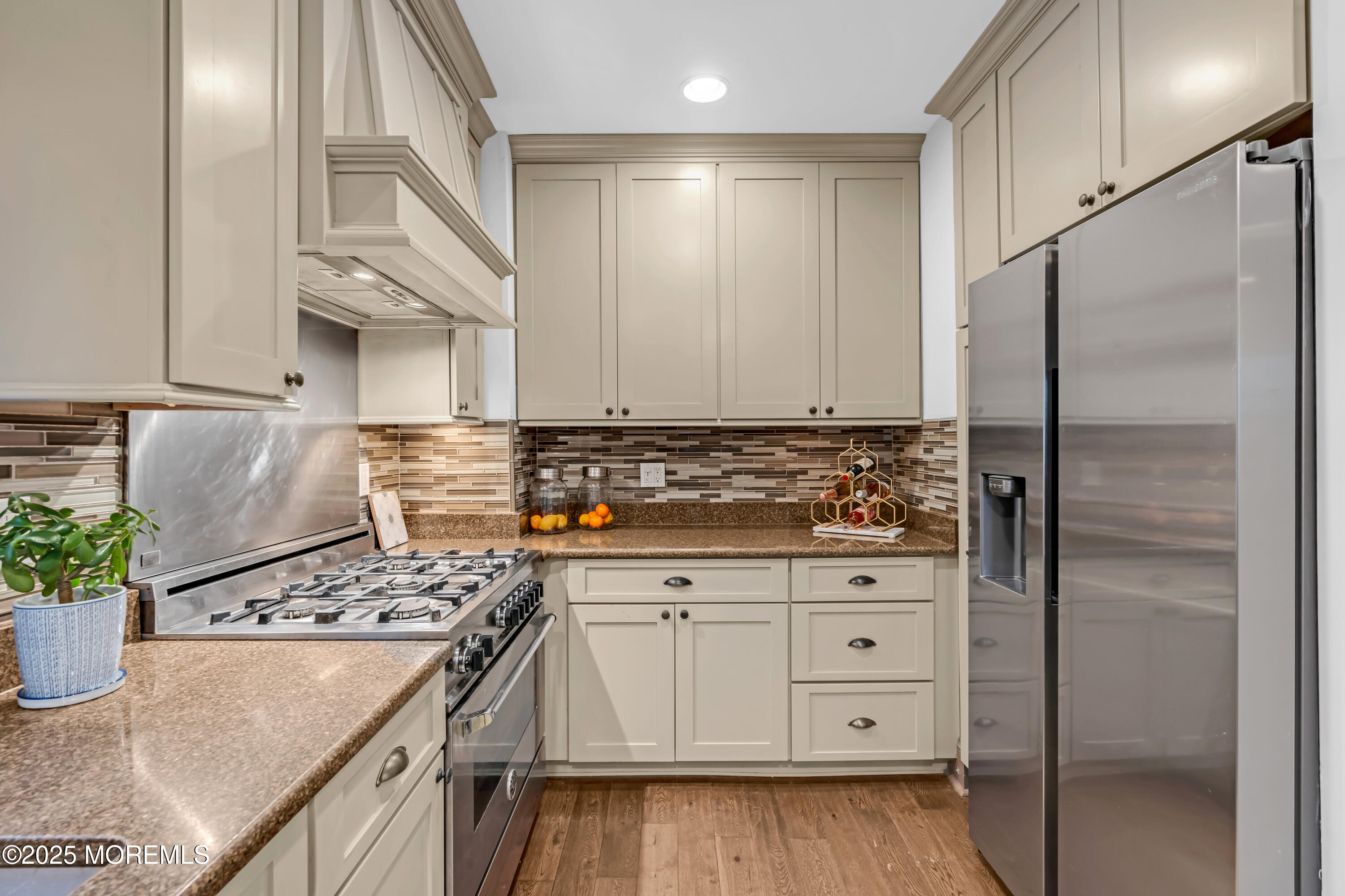18 Middletown Avenue Atlantic Highlands, NJ 07716 - Photo 21 of 35 a kitchen with white cabinets and appliances
