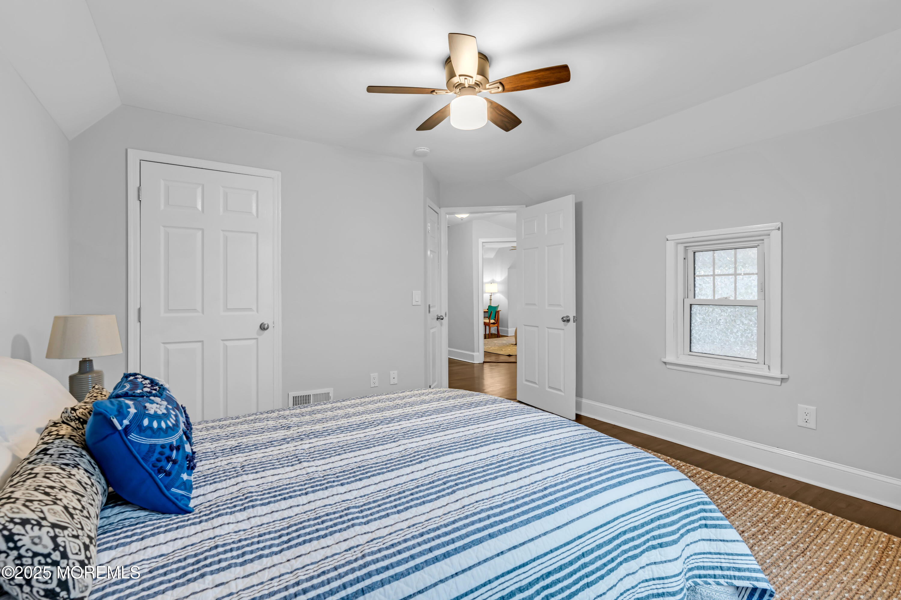 18 Middletown Avenue Atlantic Highlands, NJ 07716 - Photo 24 of 35 a bedroom with a bed and a chandelier