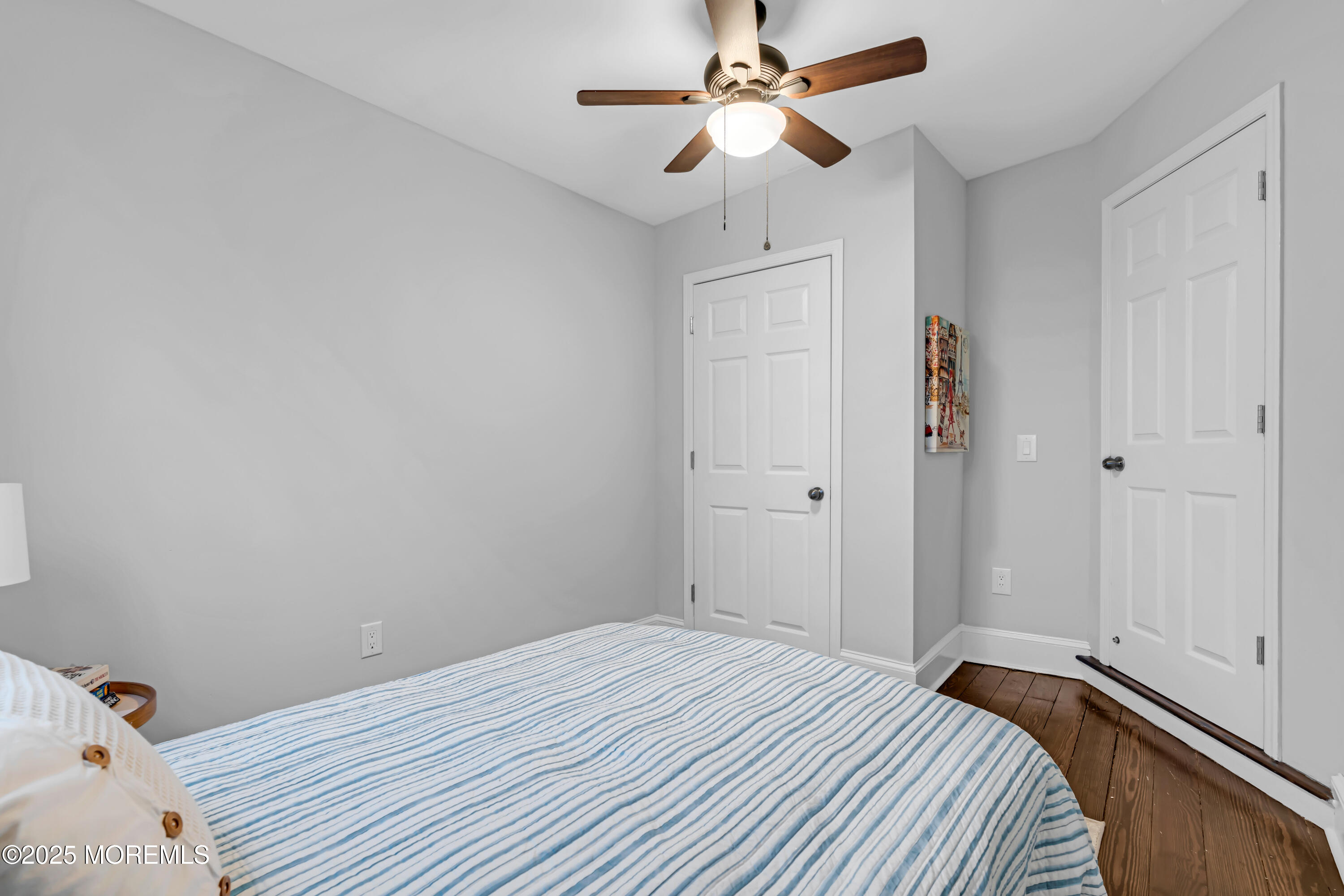 18 Middletown Avenue Atlantic Highlands, NJ 07716 - Photo 30 of 35 a bedroom with a bed and a chandelier