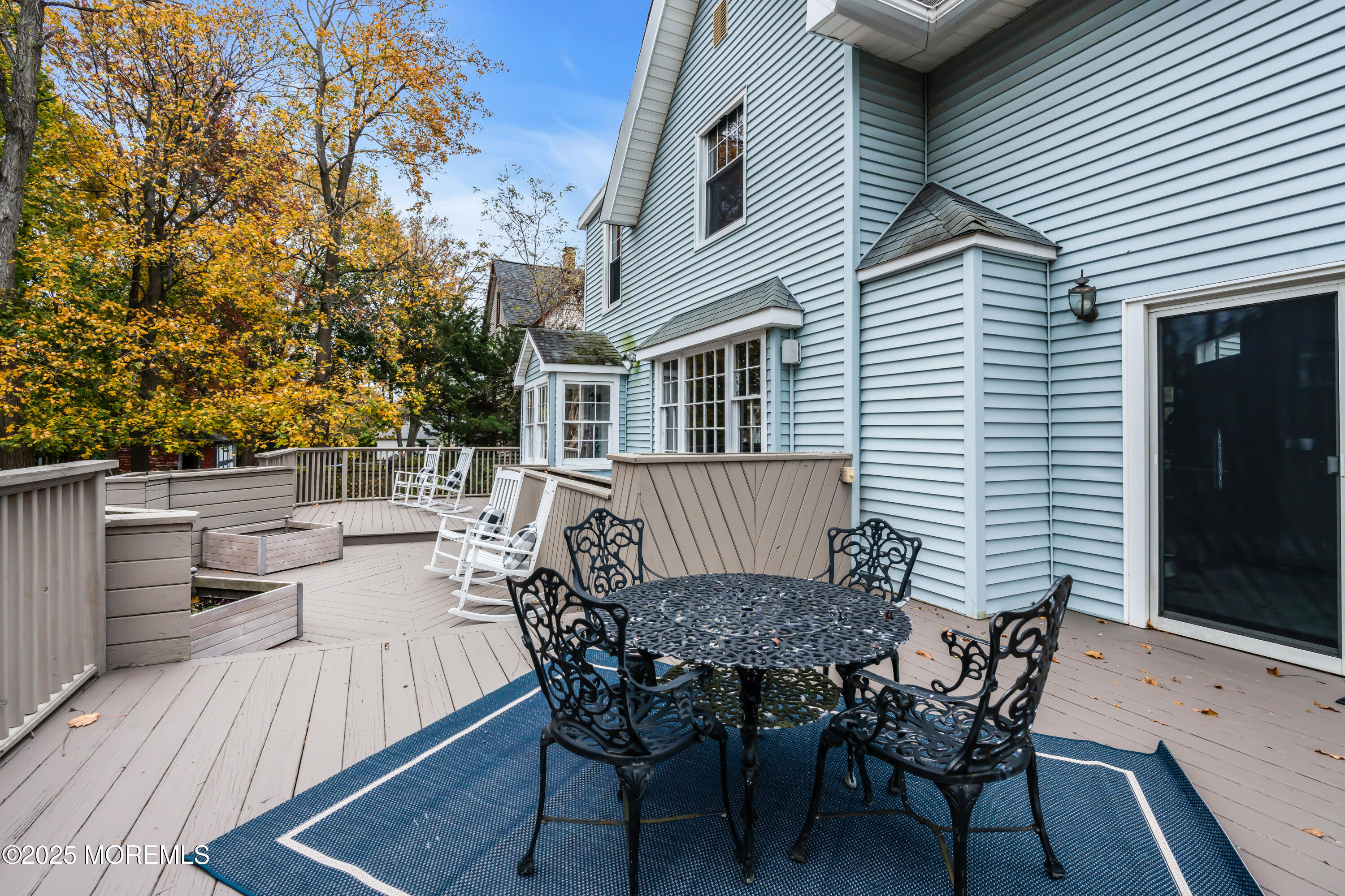 18 Middletown Avenue Atlantic Highlands, NJ 07716 - Photo 34 of 35 a view of a patio with table and chairs and wooden floor