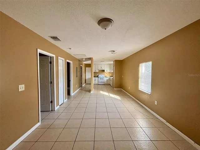 a view of an empty room and window