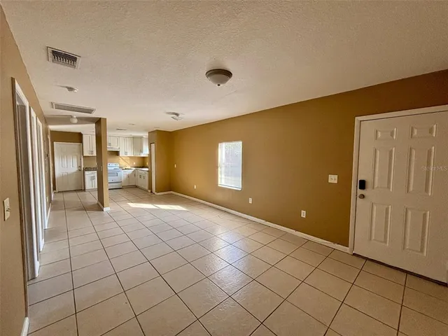 a view of a livingroom with a dinning table and chair