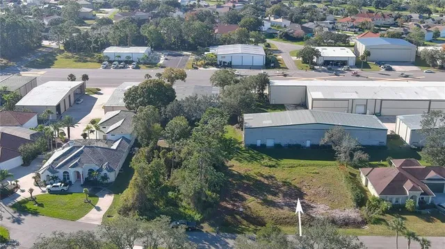 an aerial view of multiple houses with yard
