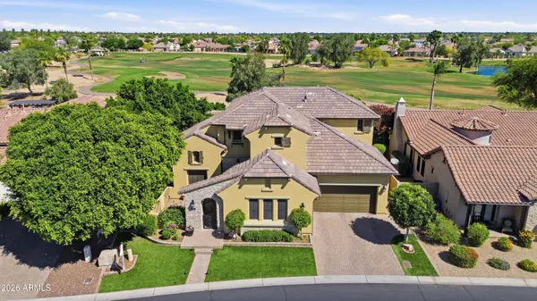 an aerial view of a house with outdoor space and lake view