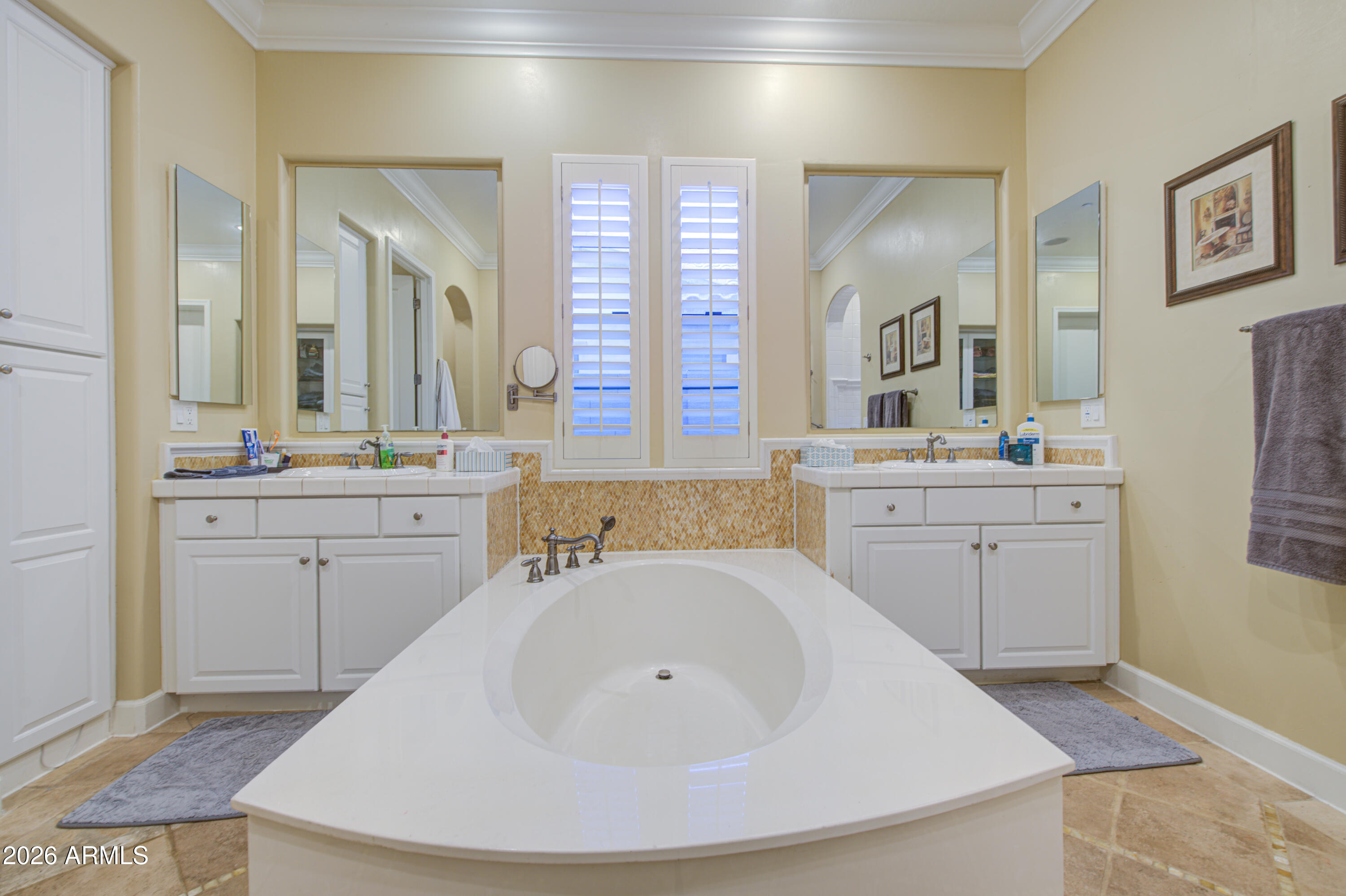 14474 West Coronado Road Goodyear, AZ 85395 - Photo 15 of 74 a bathroom with a sink and a mirror