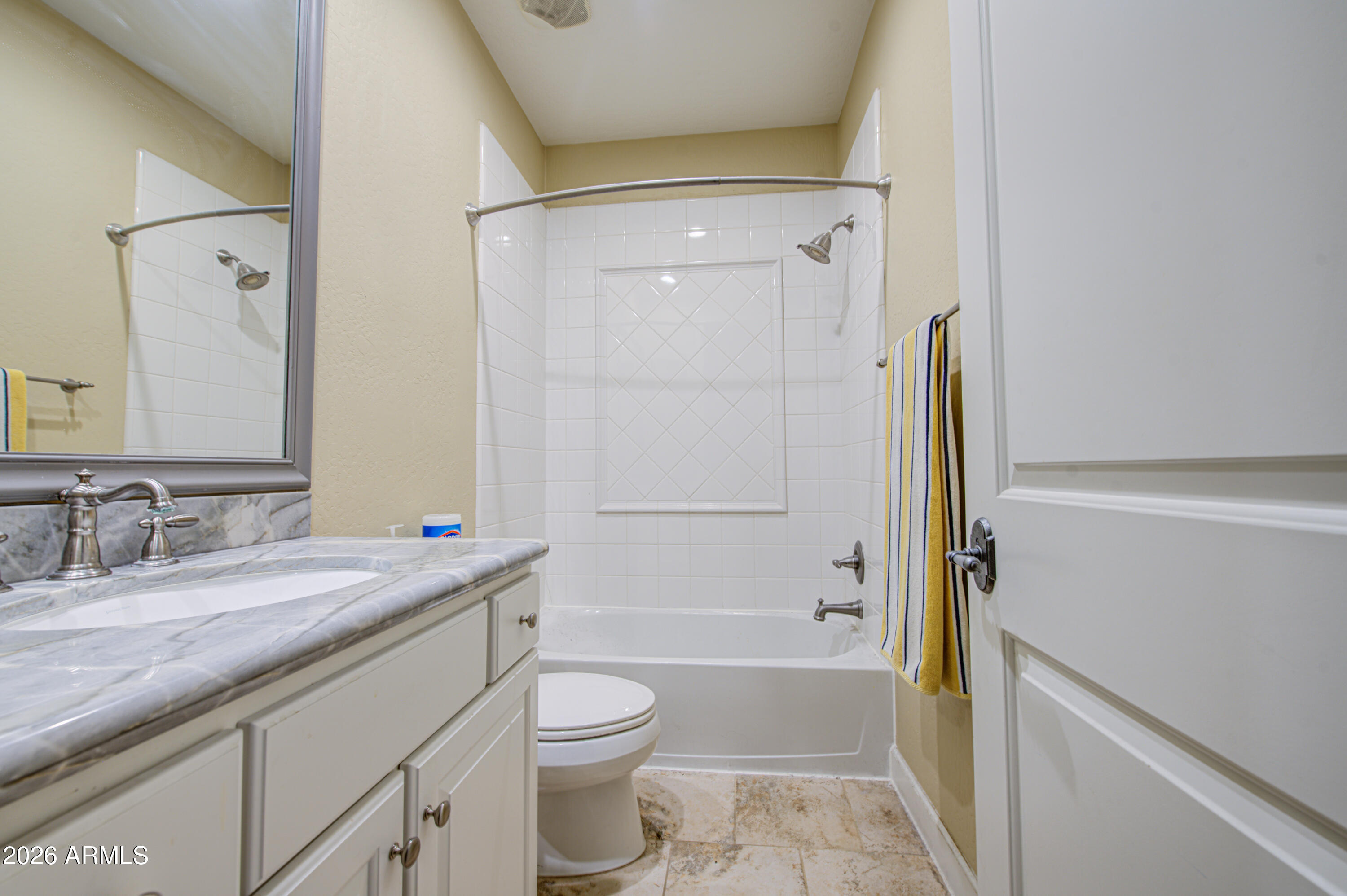 14474 West Coronado Road Goodyear, AZ 85395 - Photo 21 of 74 a bathroom with a granite countertop sink toilet and shower