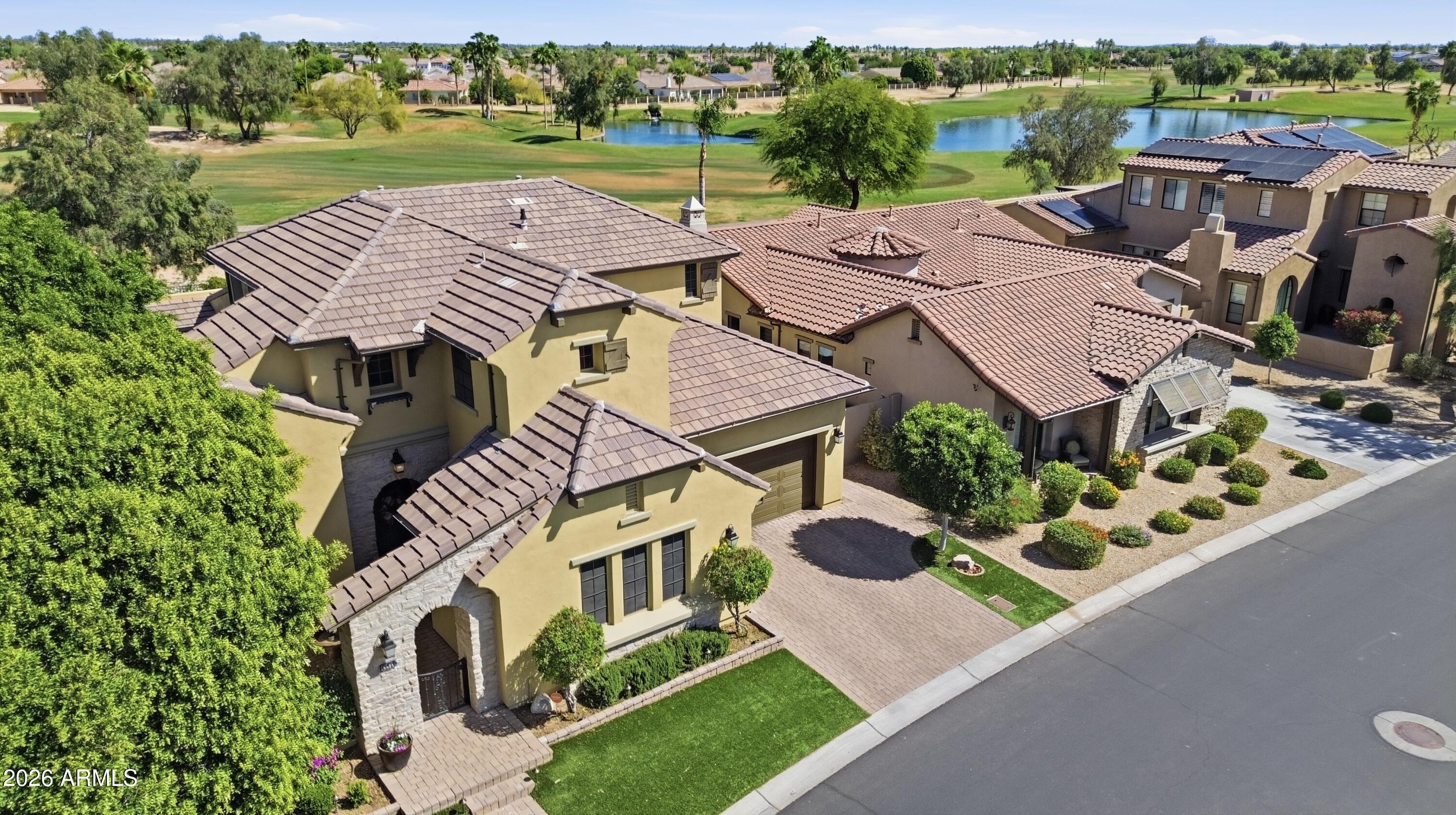 14474 West Coronado Road Goodyear, AZ 85395 - Photo 2 of 74 an aerial view of a house with outdoor space and lake view