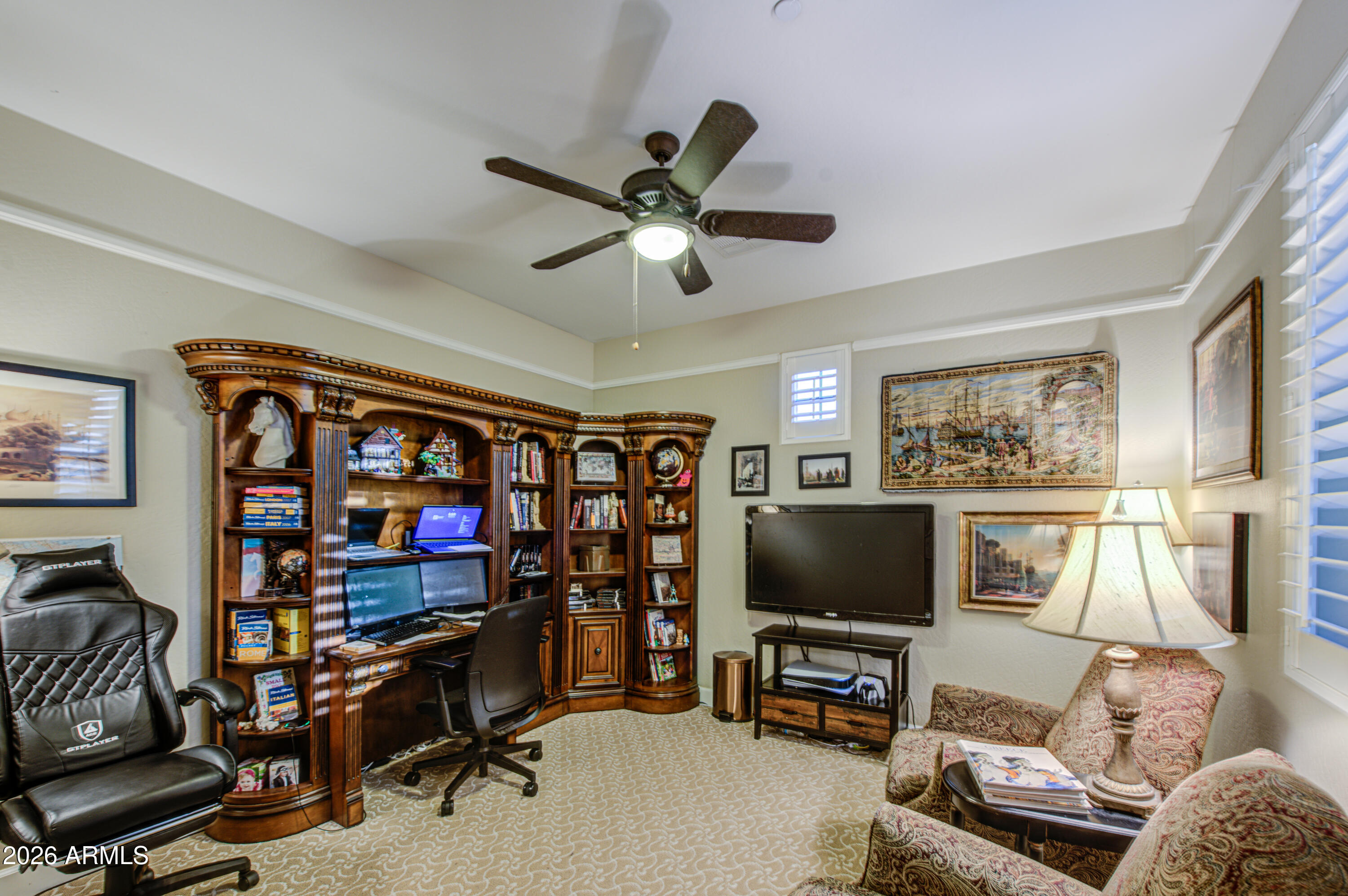 14474 West Coronado Road Goodyear, AZ 85395 - Photo 33 of 74 a living room with furniture and a flat screen tv